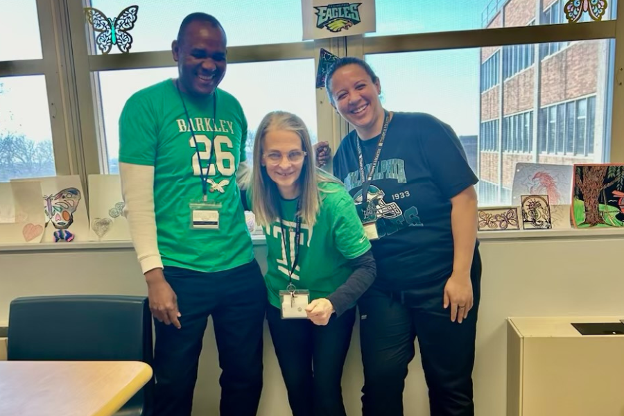Feristin, Brodersohn, and Guy show off their best Eagles gear—and their fighting spirit!