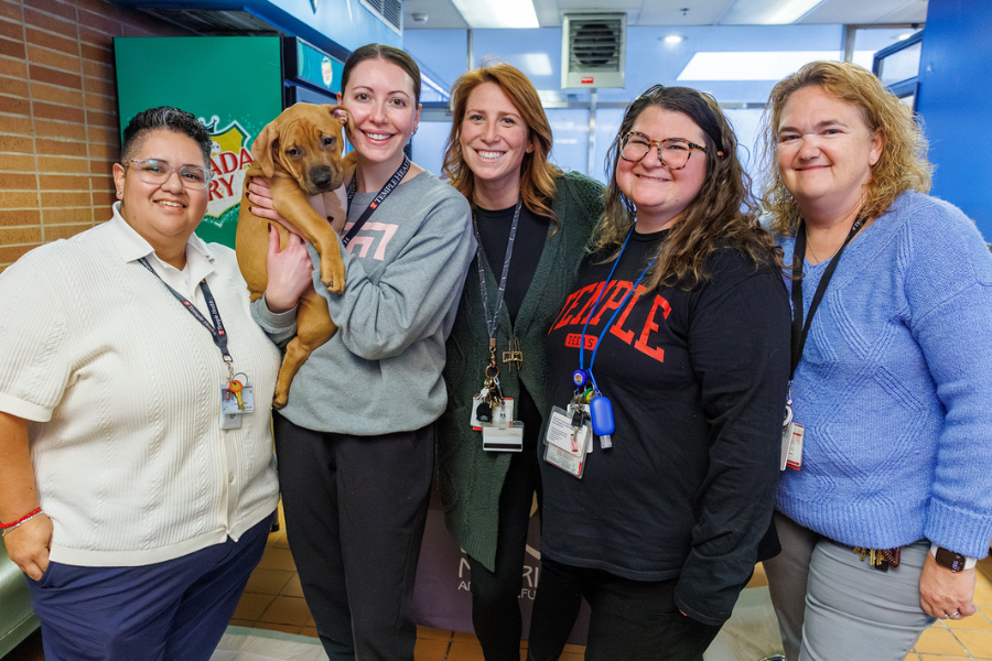 Smiling for a photo at the Temple Tails Adoption Event