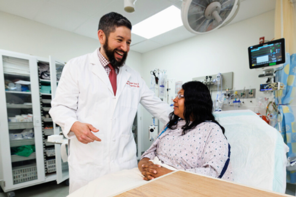 Dr. Benjamin Slovis conferences with a patient.