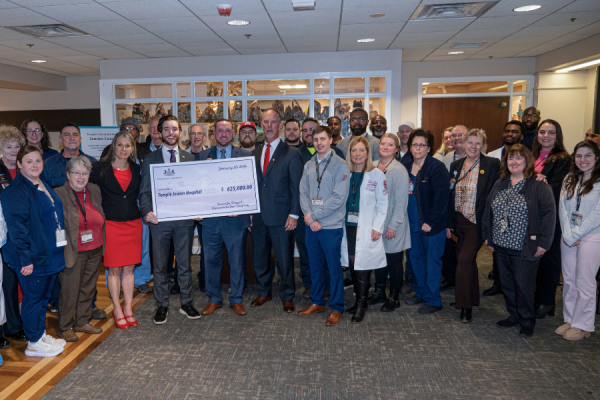Senator Picozzi (fourth from left) and Representative Dougherty (fifth from left) with Jeanes’ Executive Director Matt Shelak (sixth from left) and Jeanes team members during the check presentation ceremony at the appreciation event.