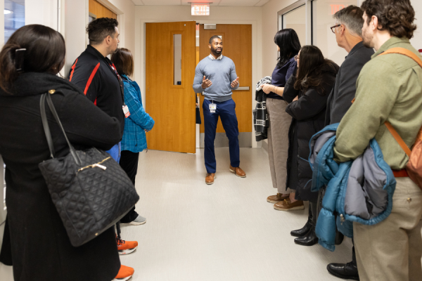 Marcus Appolon, Nurse Manager of TUH-Episcopal Campus’ Crisis Response Center, gives members of the collaborative a tour of the hospital.