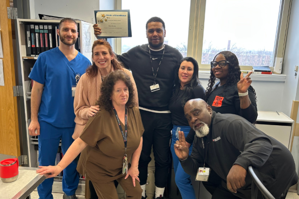 Brian Morman (center) celebrates his Exceptional Employee Award with some of his colleagues.