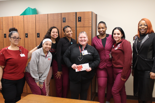 Desiree Velez-Rodriguez (center), one of the winners of the January 2026 TFP C.A.R.E.S. Award.