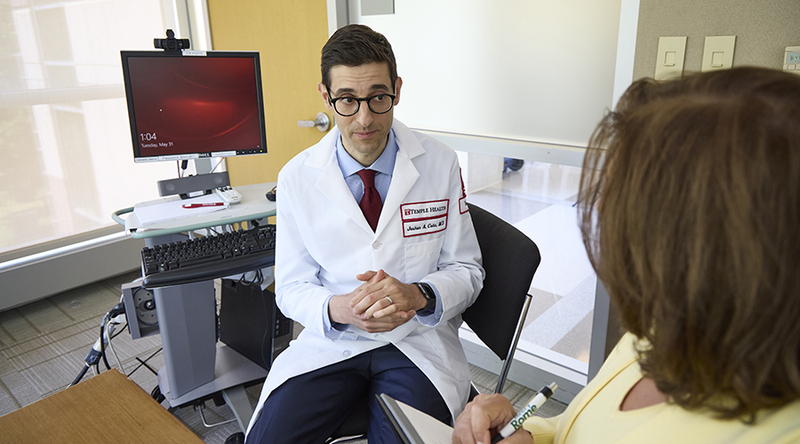 Dr. Cohn with a patient