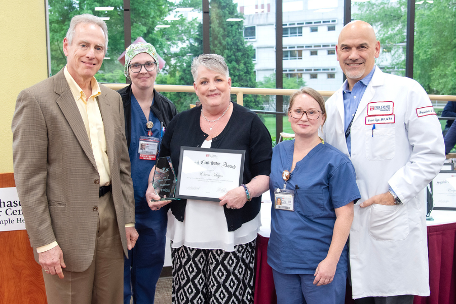 Eileen Hayes, Unit Aide, Operating Room, Fox Chase (center) with (from left) Jonathan Chernoff, MD, PhD, Cancer Center Director; presenting speakers Dawn Smeja and Megan Welsh; and Fox Chase President and CEO Robert Uzzo, MD, MBA, FACS.