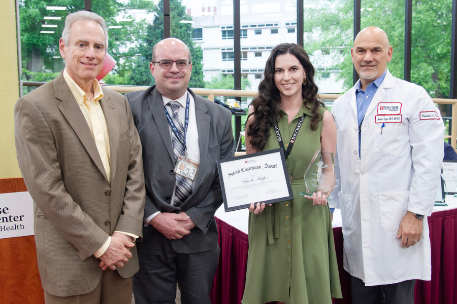 Sarah Jayne Hughes, Editorial Coordinator, Communications, Fox Chase (second from right) with (from left) Jonathan Chernoff, MD, PhD, Cancer Center Director; presenting speaker Jeremy Moore; and Fox Chase President and CEO Robert Uzzo, MD, MBA, FACS.