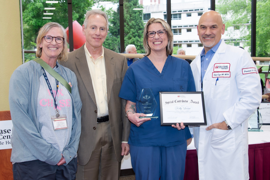 Kelly Anne Lanni, Staff Tech/CT, Radiology-Cat Scan, Fox Chase (second from right) with (from left) presenting speaker Donna Hazlett; Jonathan Chernoff, MD, PhD, Cancer Center Director; and Fox Chase President and CEO Robert Uzzo, MD, MBA, FACS.