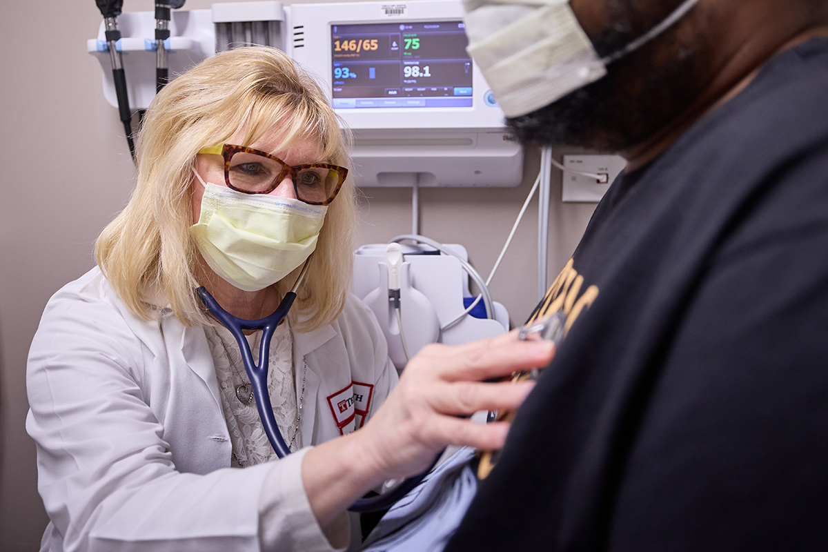 physician examines patient