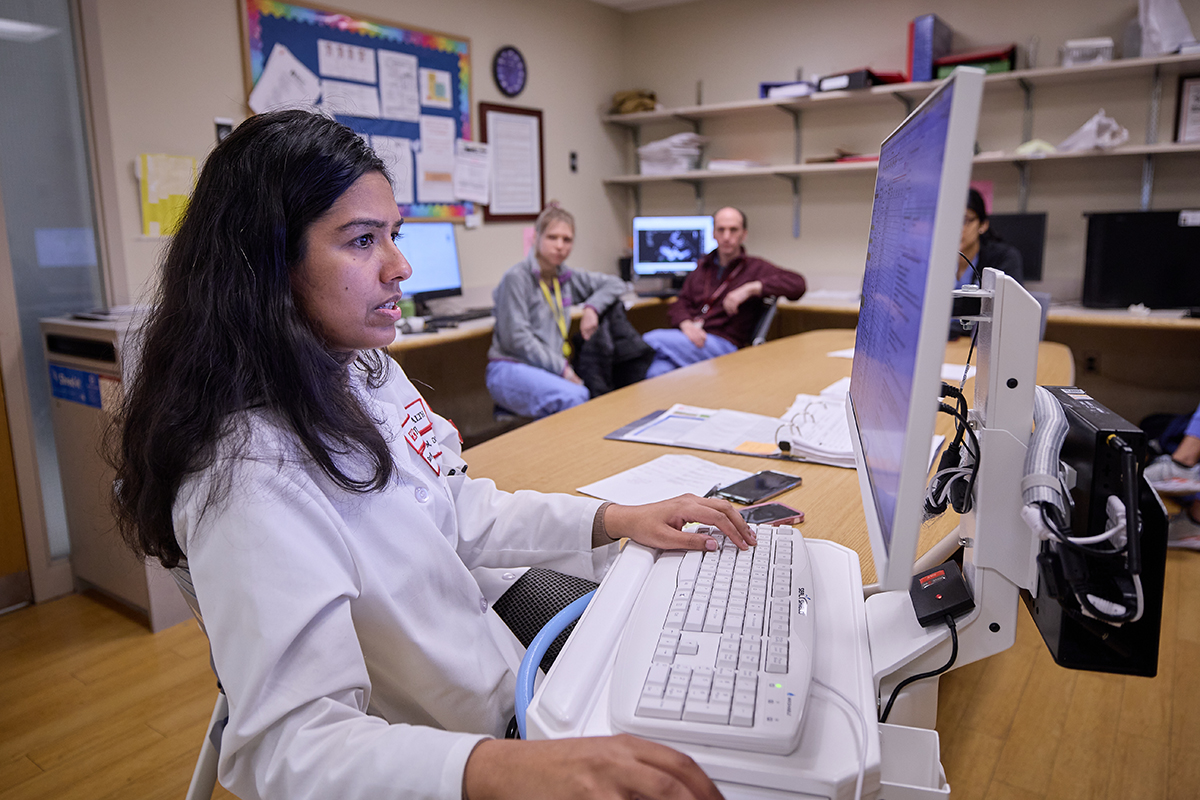 physician at keyboard