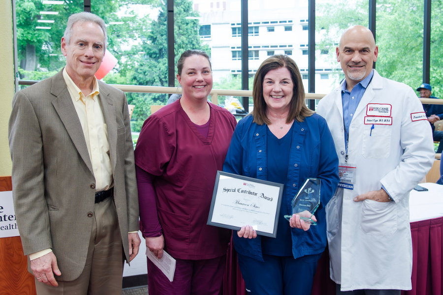 Maureen Sims, Advanced Nurse IV/OP, E. Norriton-Radiation Oncology, Fox Chase (second from right) with (from left) Jonathan Chernoff, MD, PhD, Cancer Center Director; presenting speaker Jaclyn Bova; and Fox Chase President and CEO Robert Uzzo, MD, MBA, FACS.