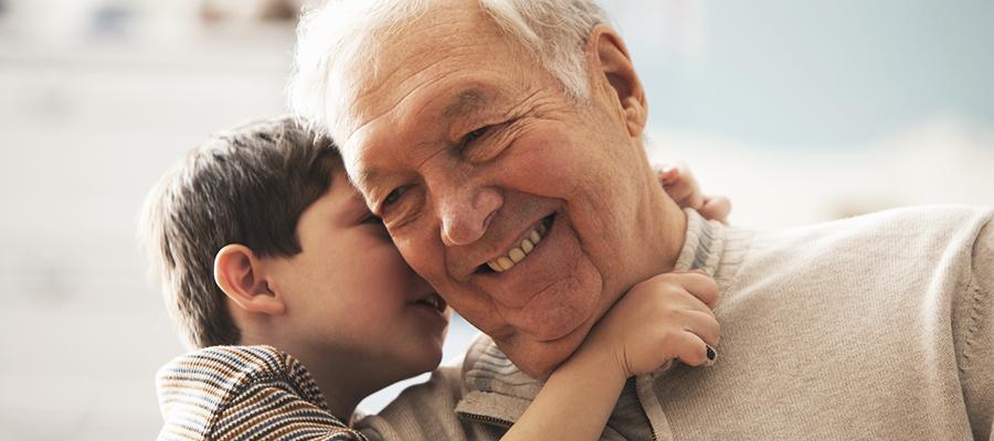Child hugging grandfather