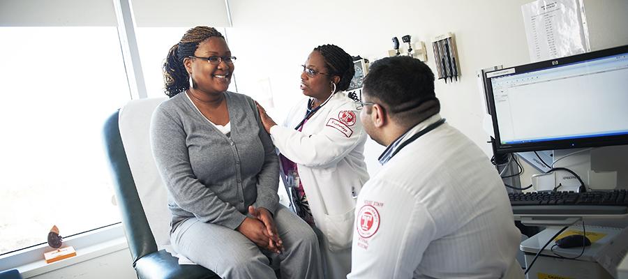 Doctors checking a patient