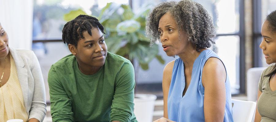 Woman talking in heart failure support group meeting