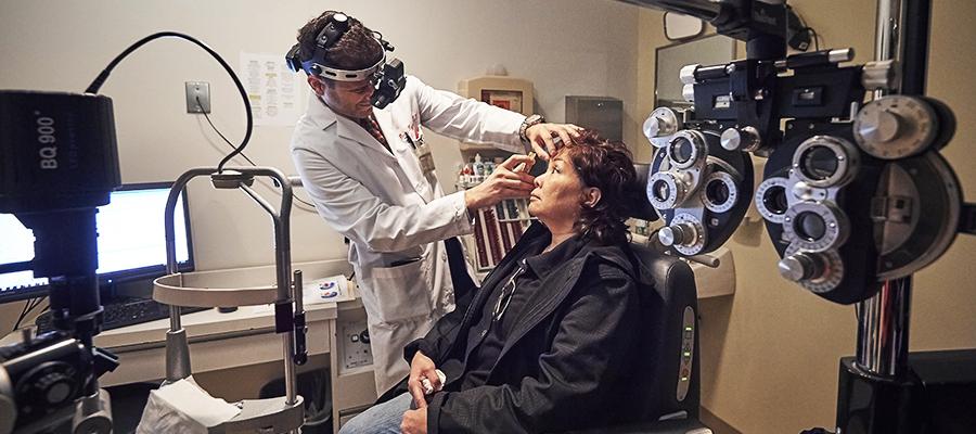 Ophthalmologist performs eye treatment