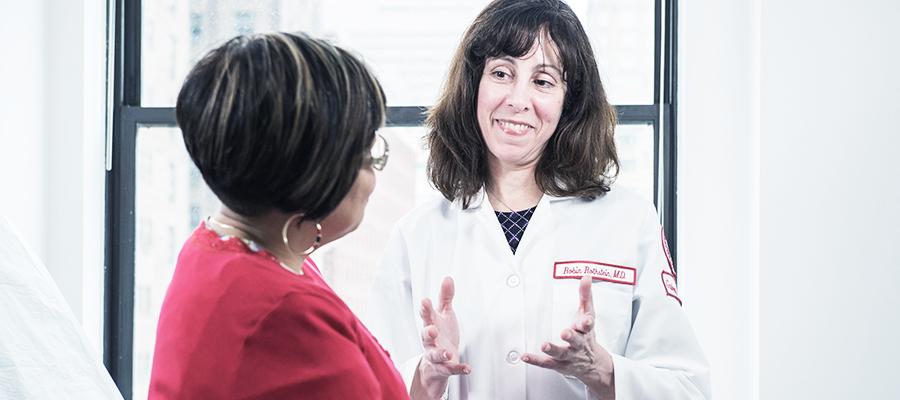 Physician talks with patient