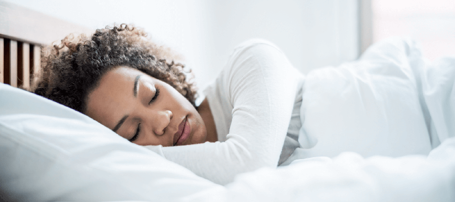 Woman sleeping peacefully in bed