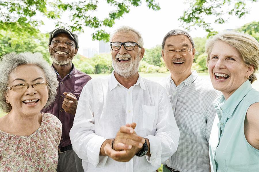 Group of multi-ethnic people smiling in park