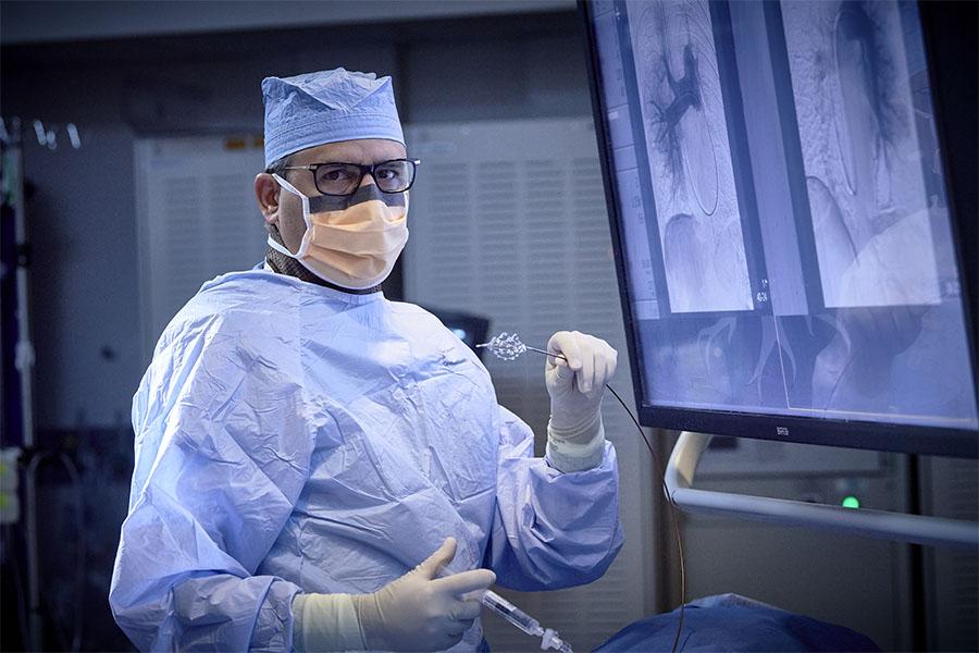 Dr. Riyaz Bashir with endovascular catheters