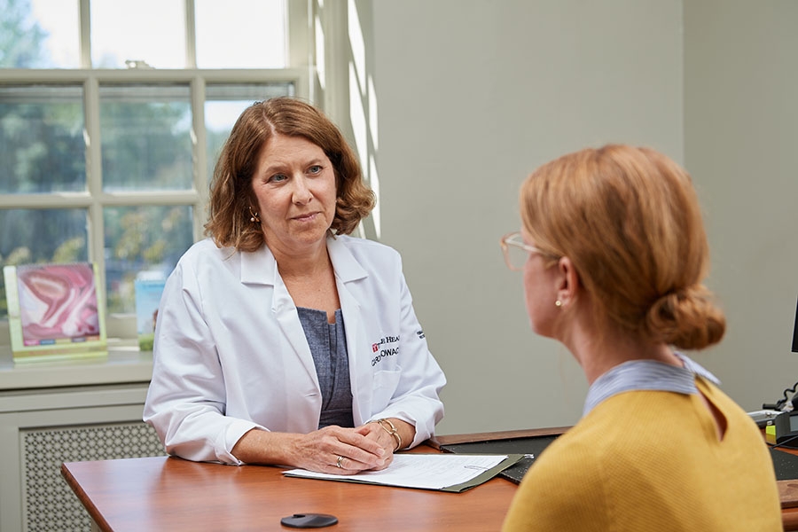 Dr. Glowacki talking with a patient