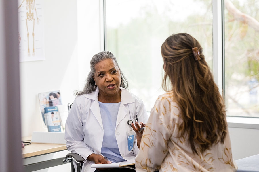 Gynecologist talking with patient