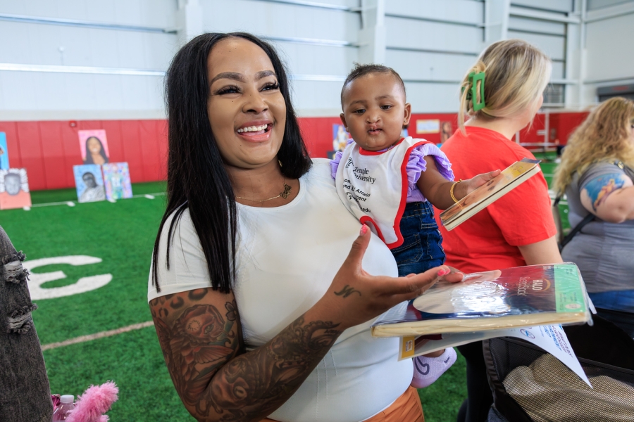 A community member and their child at the Community Baby Shower.