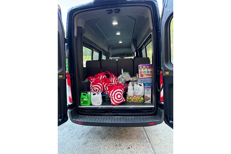 Loading some of the bags into the Gift of Life shuttle to take them to Howie's House.