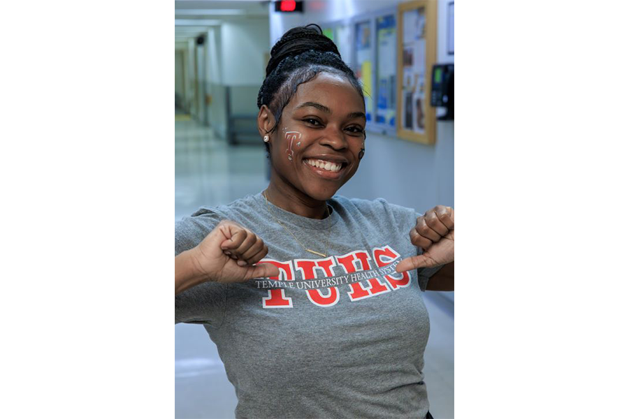 Face paint helps this team member show her Temple Health pride.