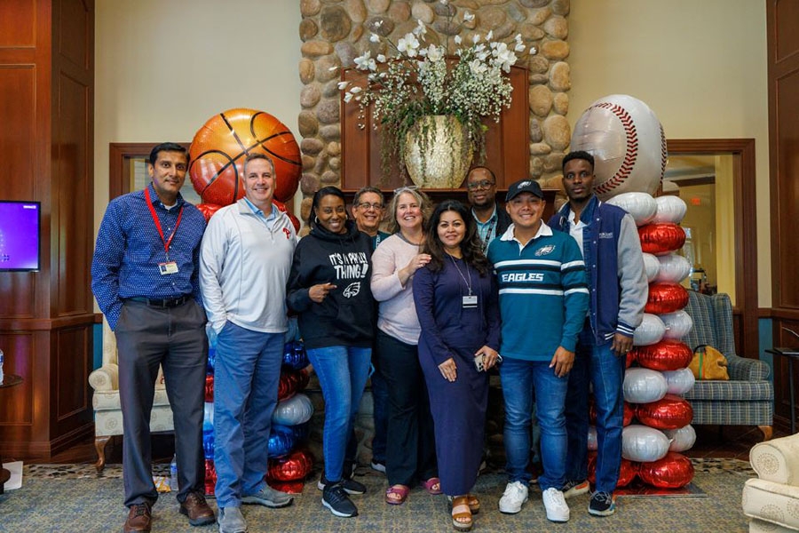 Team members pose together at the Women & Families Campus.