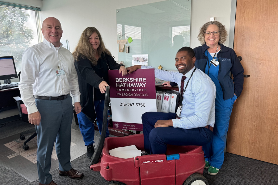 Team Malpractice Freaky Finders submitting a Berkshire Hathaway sign and red wagon to John Robison (far left)