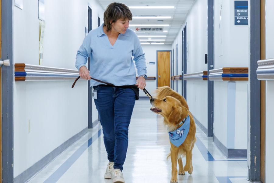 Jane and Berni walk the halls of Episcopal during his December 1st visit.