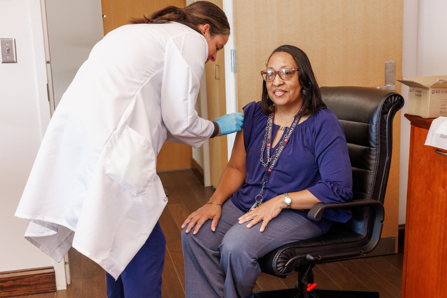  Senior Administrative Coordinator Gail Young-Holland gets her flu vaccine.