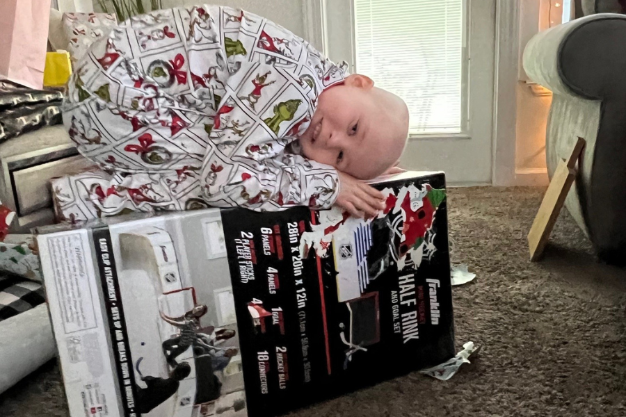 Gavin with one of his presents—a hockey half rink and goal set—on Christmas morning.