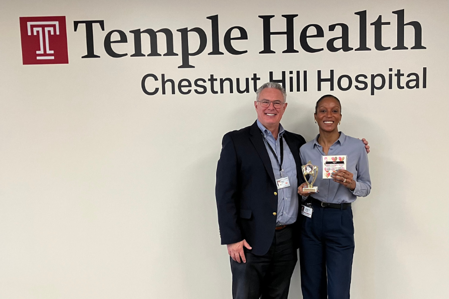 Tausha Saunders, winner of the “Love from First Bite” Valentine’s Day Bake-Off contest, with Temple Health-Chestnut Hill Hospital’s President & CEO Richard Newell, MPT, DPT. 