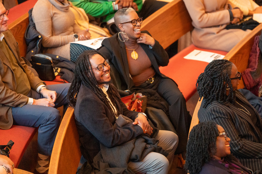 Attendees (including Philadelphia City Councilman Jeffrey Young, Jr., left) enjoy remarks from the ceremony's speakers.