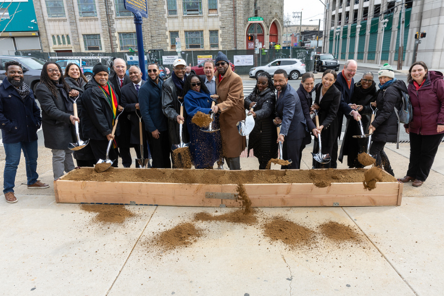 Supporters (including the Reverend Mike Major, center, who led the project) gather to celebrate the groundbreaking of the Reverend Leon H. Sullivan Community Impact Center. 