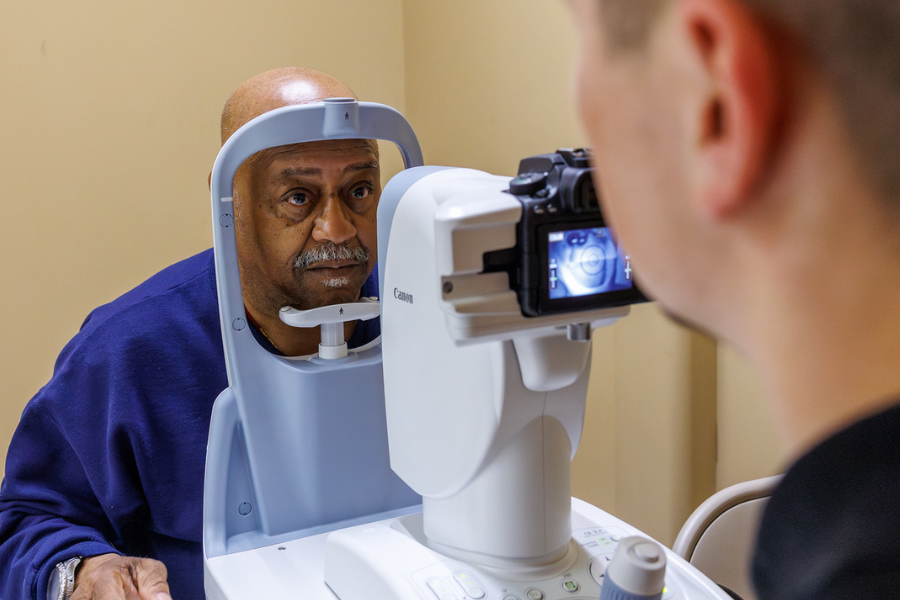A community member receives a retinal screening from one of our Temple Health Ophthalmologists.