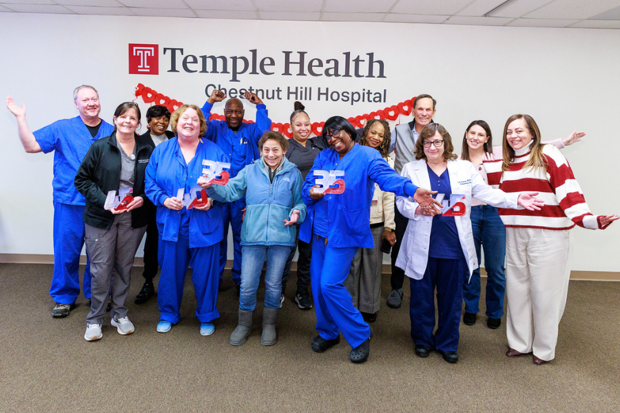 The employees honored at the Chestnut Hill Hospital ceremony enjoy a celebratory moment with their managers and leadership. 