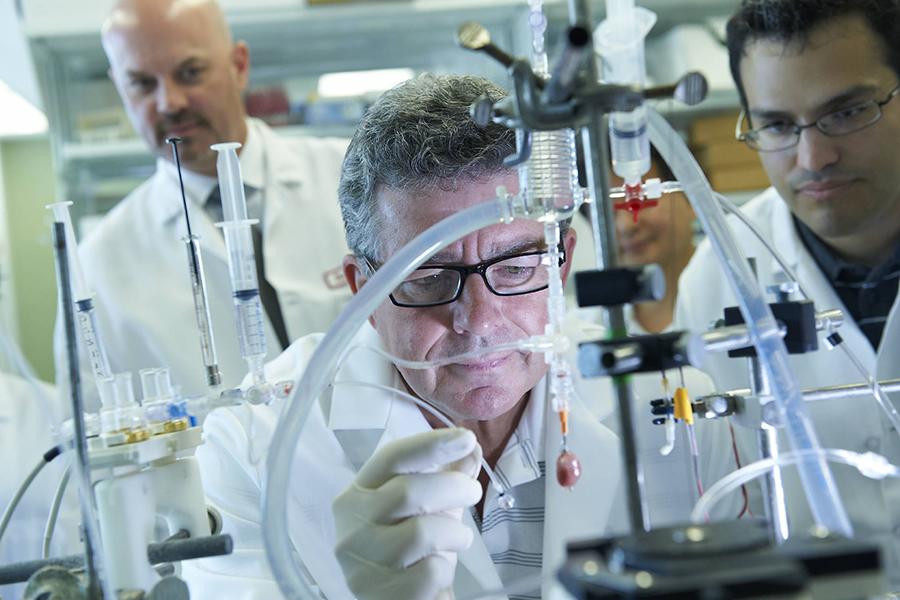 Dr. Steven Houser conducting research in lab
