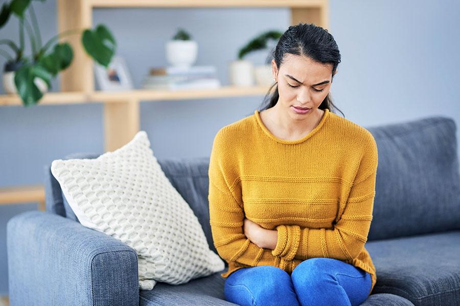Woman feeling bloating in her stomach