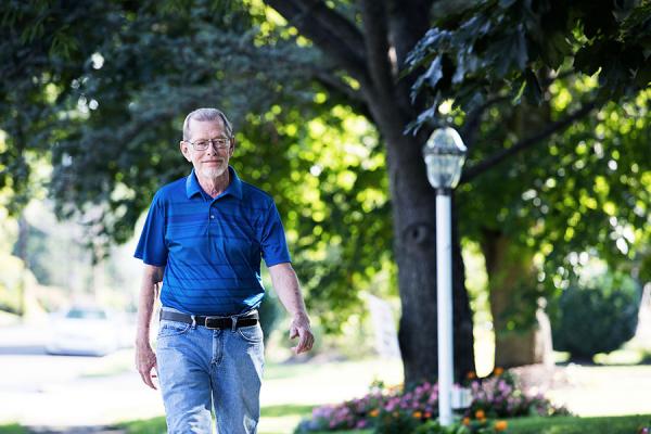 Robert H., Tracheobronchomalacia patient walking down the street