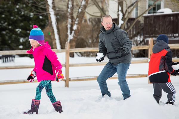 Sean having a snowball fight with his two kids