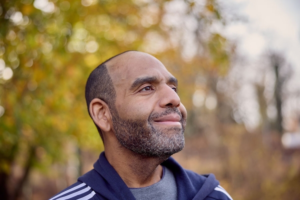 Ronnie smiling looking up outside