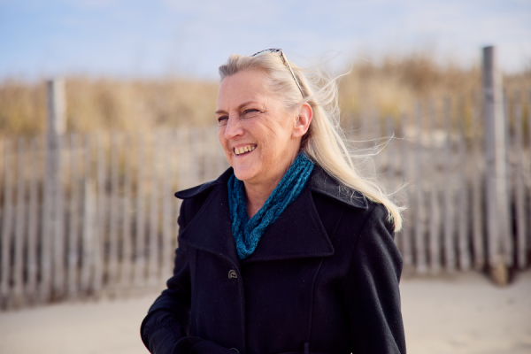 Donna smiling on the beach