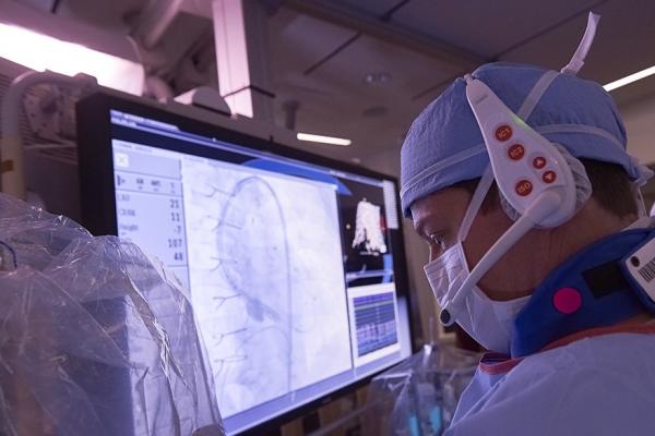 Closeup of cardiologist examining screen during procedure