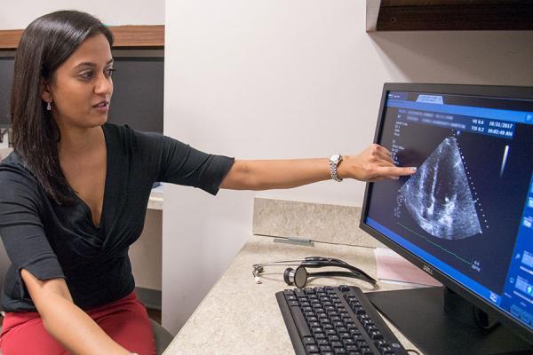 Dr. Anjali Vaidya showing a scan