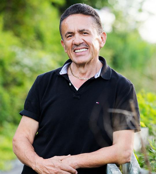 Nick K. leaning against fence