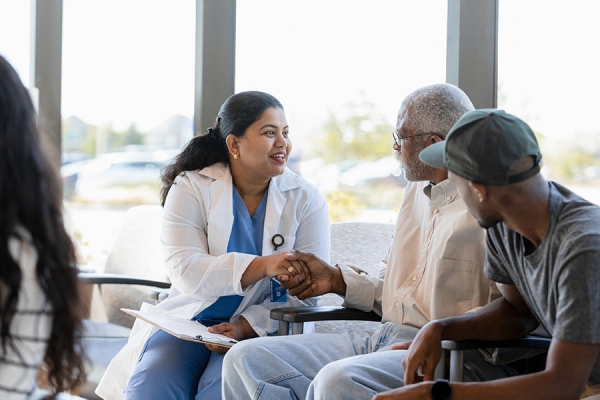 Nurse shaking hands with patient