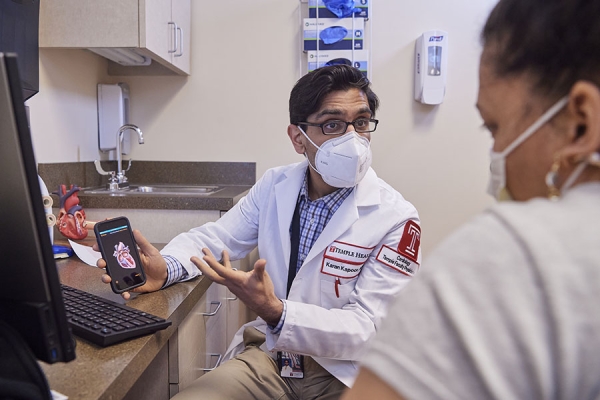 Karan Kapoor discussing TAVR with patient