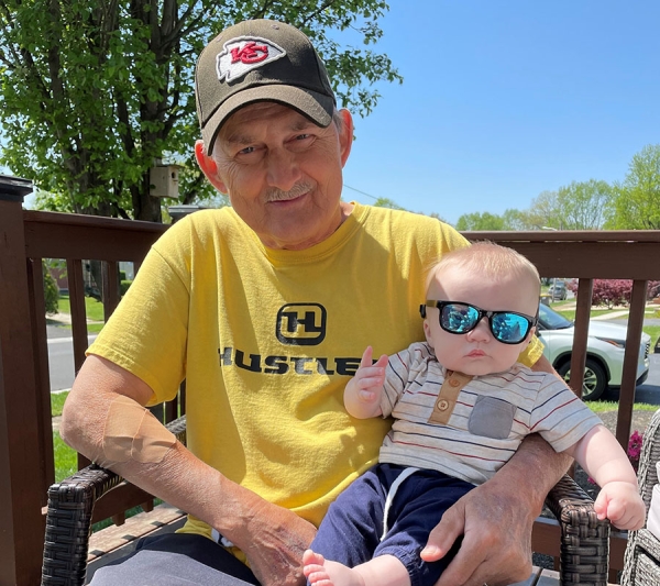 John W. holding his grandchild