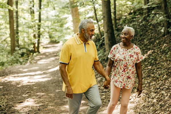 Happy couple walking in park